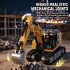 A highly realistic mechanical joints mini RC excavator in yellow and black on a dirt surface.