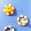 A colorful bath toy featuring a yellow frog shape and an orange ring with various water play features.