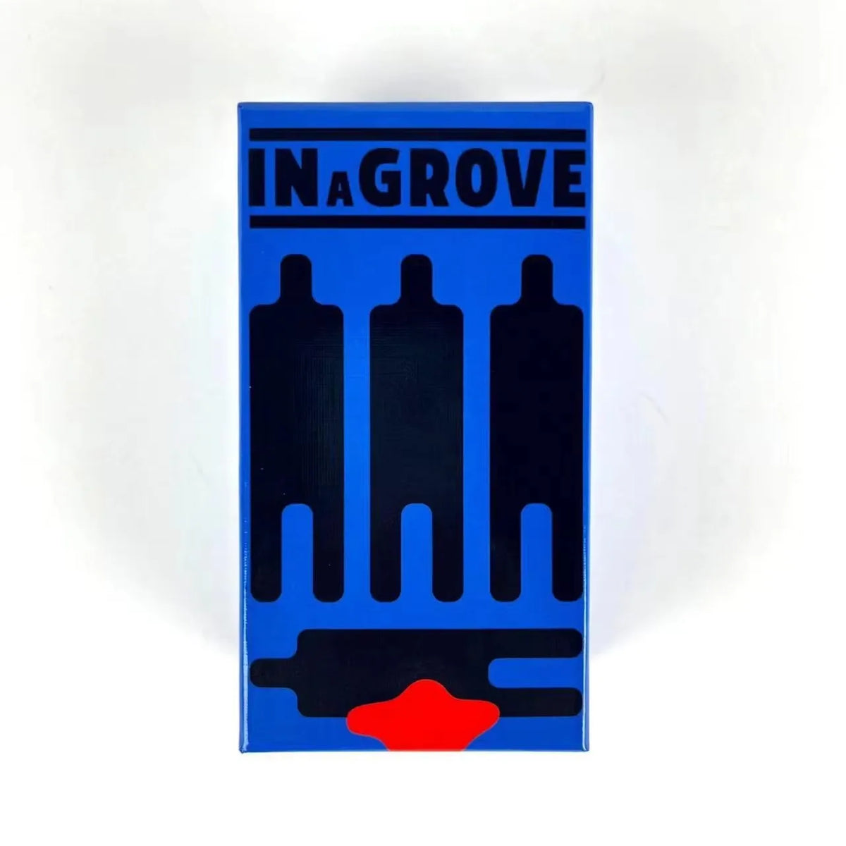A vertical blue board game box titled IN A GROVE featuring black silhouettes of figures and a red shape at the bottom.