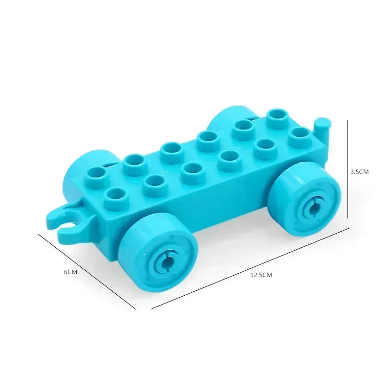 A teal plastic building block set shaped like a vehicle with wheels, used for city traffic play.