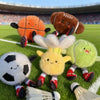 A collection of plush sports balls including a basketball, soccer ball, and other soft mini balls.