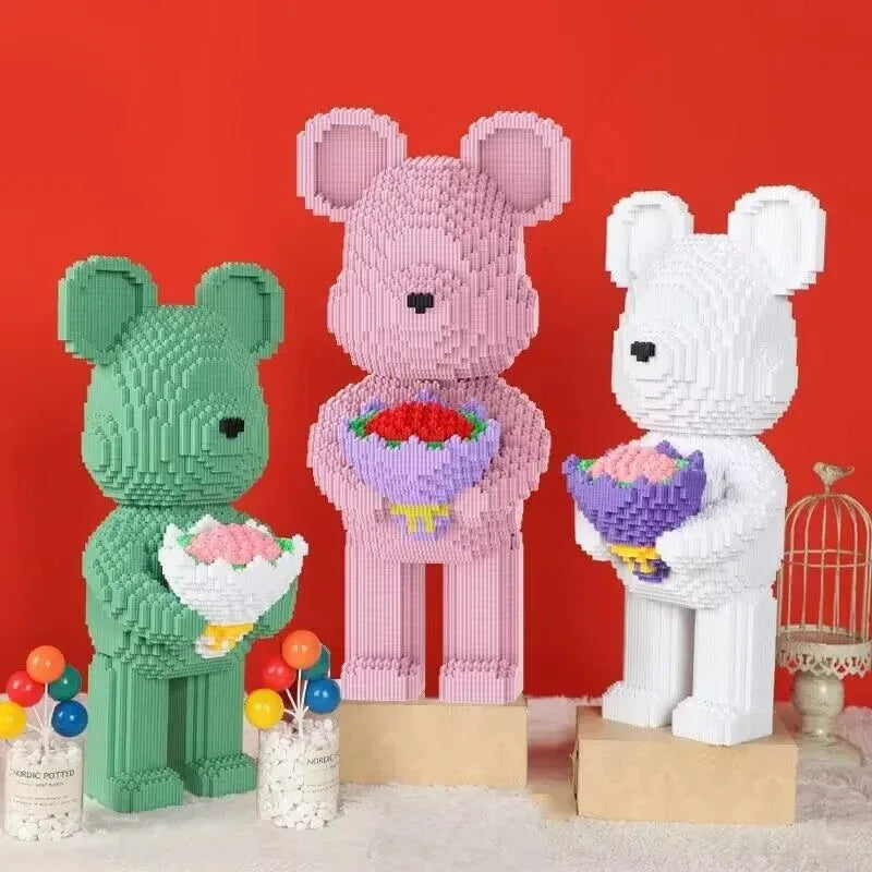 A set of pink and white flower bear building blocks made with micro bricks displayed against a red background.