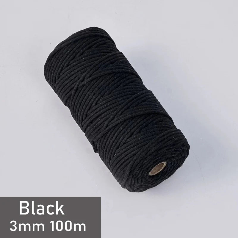 Black 3mm cotton macrame cord in a spool, measuring 100 meters.
