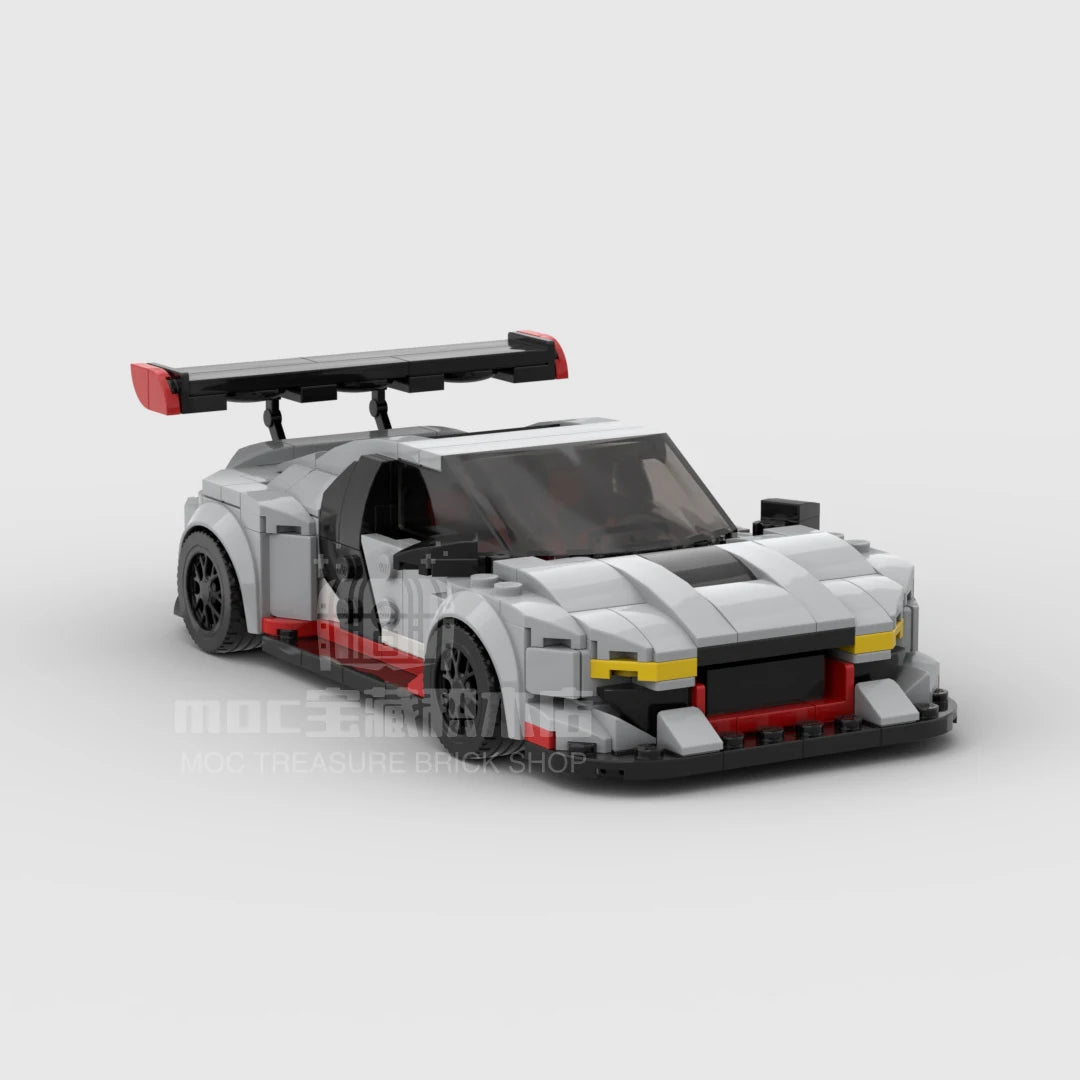 A detailed model of a modern sports car built from building blocks, featuring silver and black colors.
