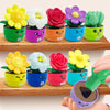 A collection of colorful potted flowers for a sorting and stacking toy, featuring various flower shapes and bright colors.