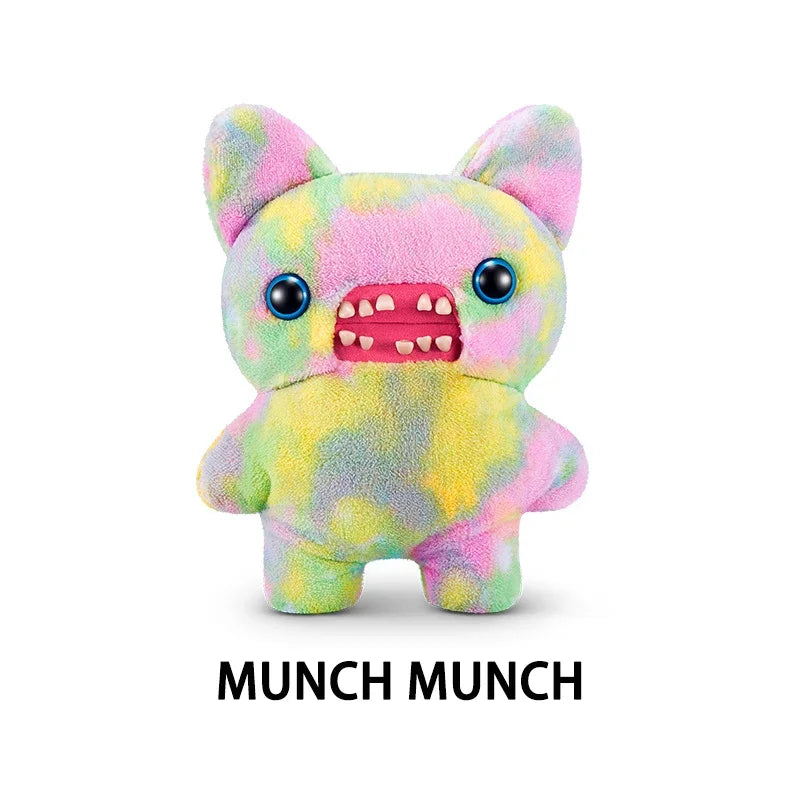 A soft, colorful plush monster toy with pink and yellow fur and a wide, toothy grin.