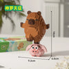 A small, brown building block figure of a capybara is shown next to its original packaging.