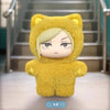 A yellow plush toy resembling a cat with a hood and light hair, displayed in a vertical shot.