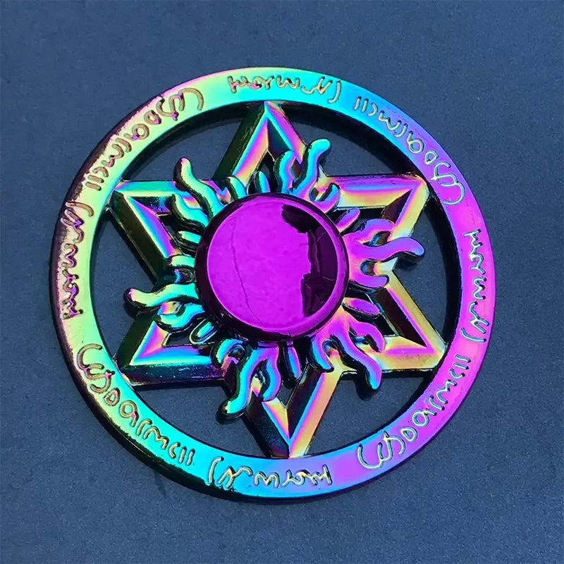 A colorful metal fidget spinner featuring a star design with a central disc, set against a dark blue background.