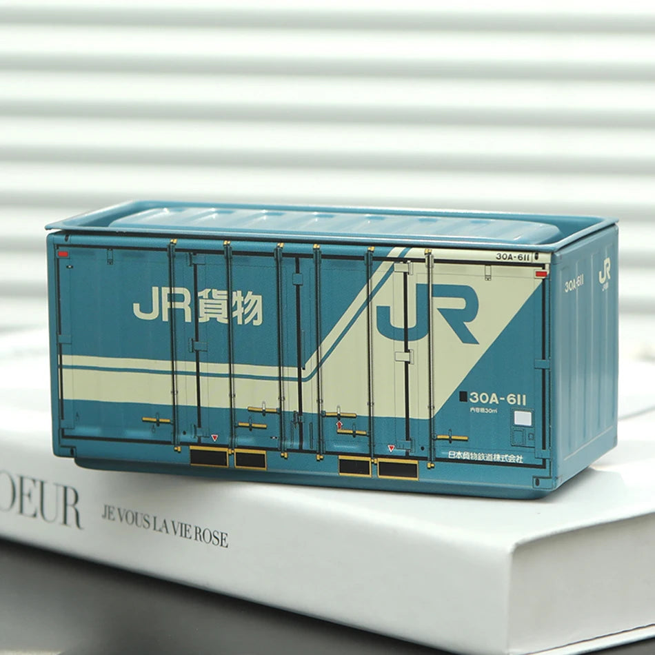 A light blue industrial storage box labeled JR cargo resting on a white surface.