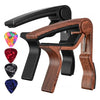 A rosewood guitar capo with five picks shown in a close-up view.