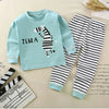 A light blue long sleeve shirt and matching striped pants pajama set featuring a zebra print for a child.