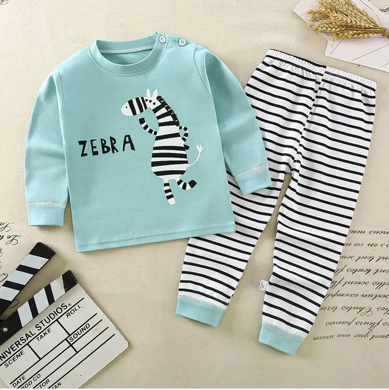 A light blue long sleeve shirt and matching striped pants pajama set featuring a zebra print for a child.