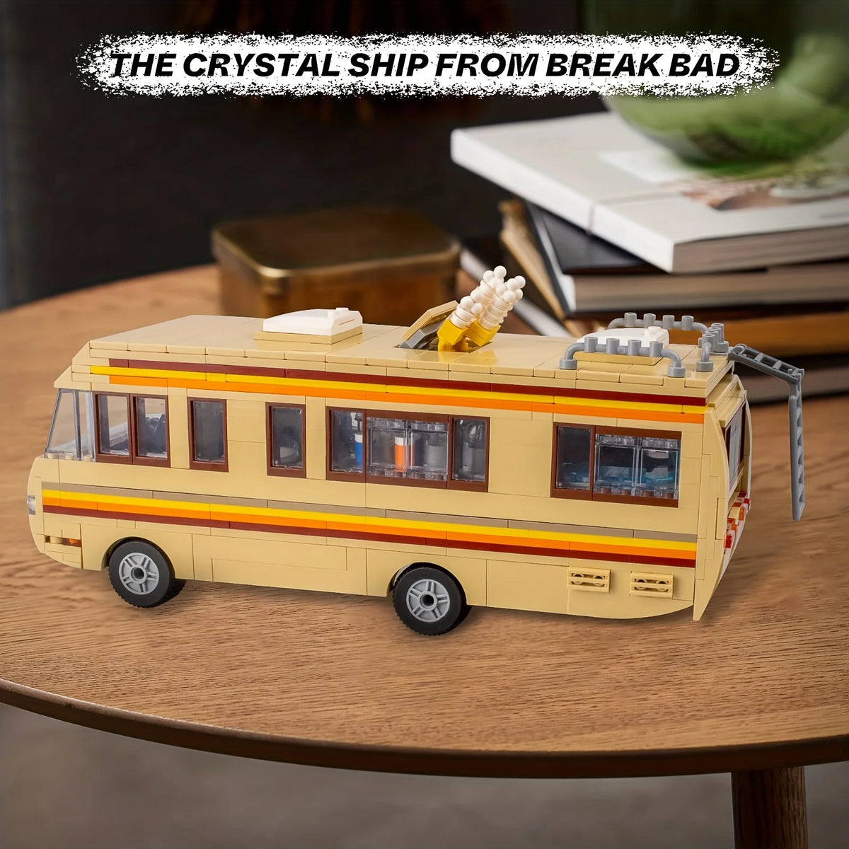 A detailed model of a yellow school bus built from the Breaking Bad series, displayed on a wooden surface.
