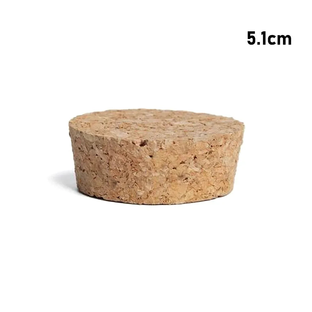 A round, light brown wooden stopper or test tube, measuring 5.1cm.