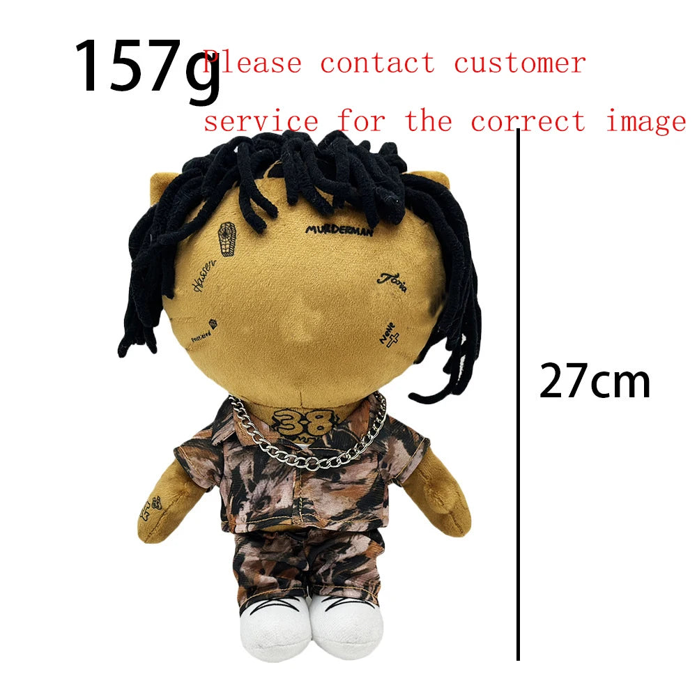 A plush doll resembling Eminem, XXXTentacion, and Frank Ocean with black hair and a patterned shirt.