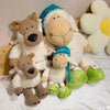 A soft plush toy depicting a wolf dressed in sheep's clothing, with white and light green accents.