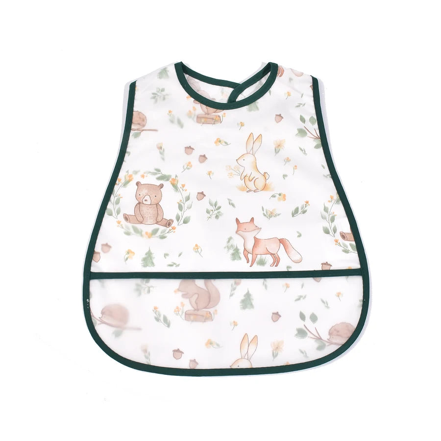 White baby bib with a green trim featuring a cartoon pattern of various woodland animals like bears and rabbits.