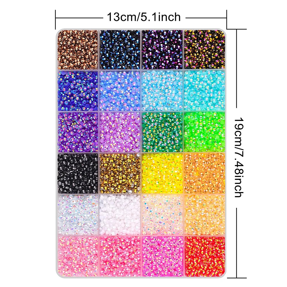 A rectangular tray of various colored flat-back rhinestones and glitter for DIY crafts