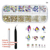 A clear plastic kit containing various colored rhinestones, glass gems, and five point drill pens and tweezers.