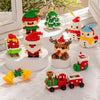 A collection of Christmas themed micro building blocks featuring Santa, reindeer, and festive greenery.