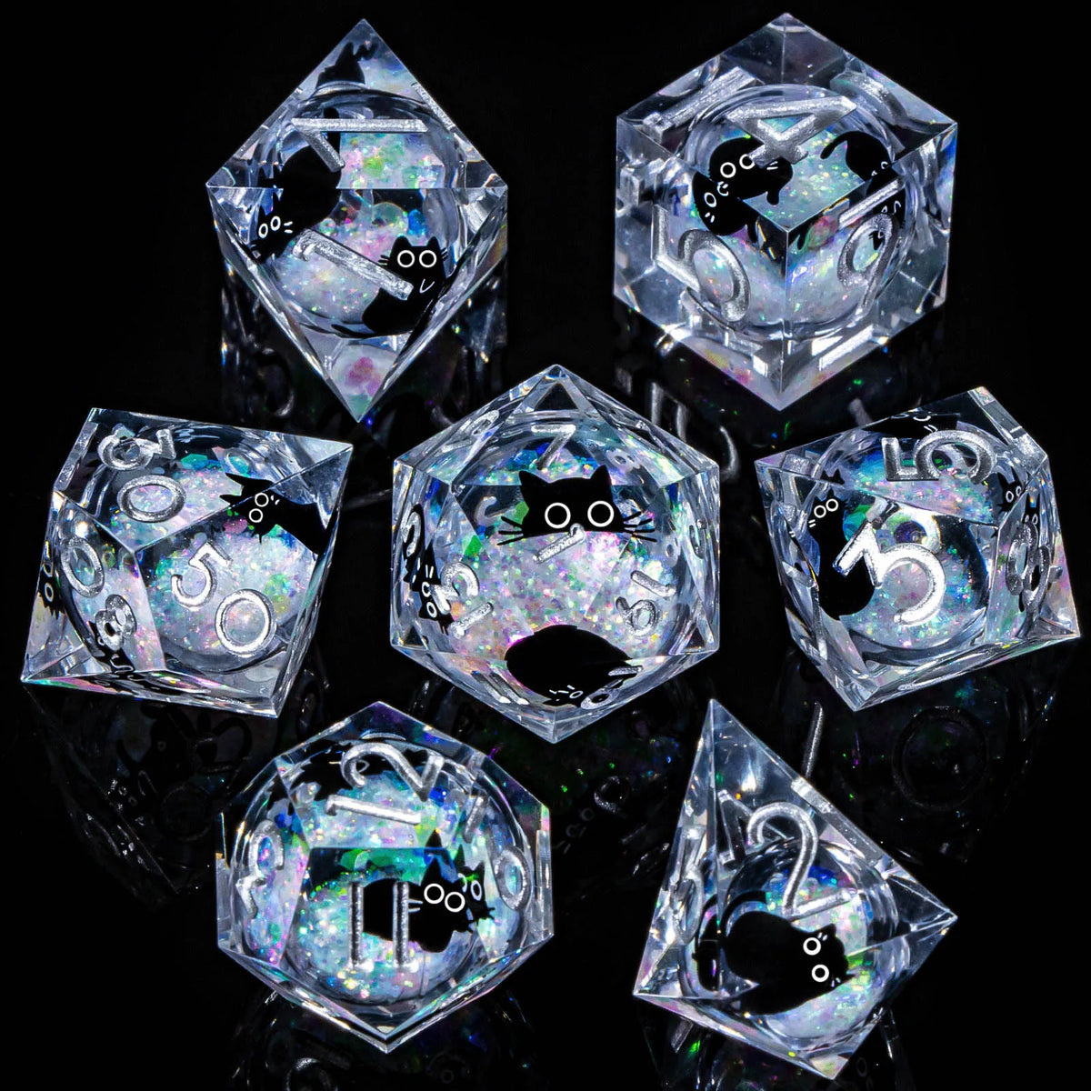 A set of six clear resin dice shaped like pyramids and hexagons with iridescent glitter inside