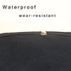 Close-up of a black waterproof and wear-resistant fabric bag with a zipper detail.