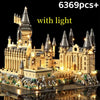 A detailed medieval castle built from light-up building blocks on a platform.