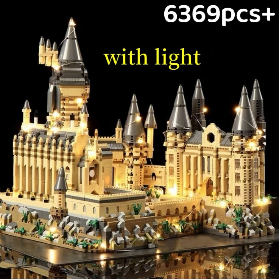 A detailed medieval castle built from light-up building blocks on a platform.