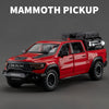 A red RAM Mammoth pickup truck model with a black roof rack and off-road tires.