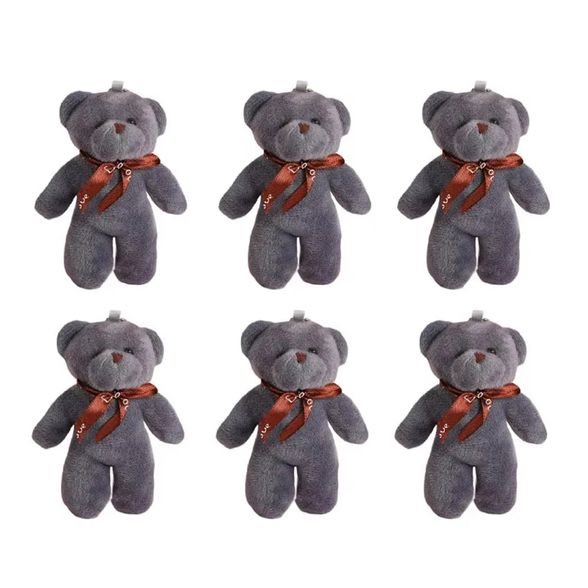 A set of six gray plush bear keychains with brown ribbon accents.