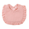 A light pink ruffled muslin cotton baby bib with an adjustable snap closure.
