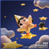 A cute yellow figurine of a crying baby with star accents against a dark blue starry background.