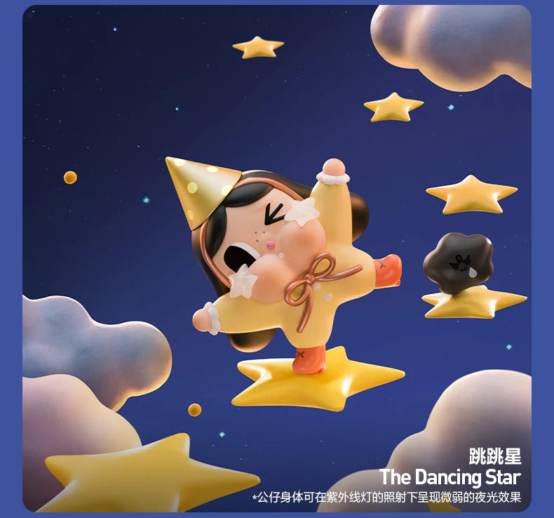 A cute yellow figurine of a crying baby with star accents against a dark blue starry background.