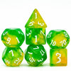 A set of seven translucent green and yellow glitter polyhedral dice, including a tetrahedron and a cube.