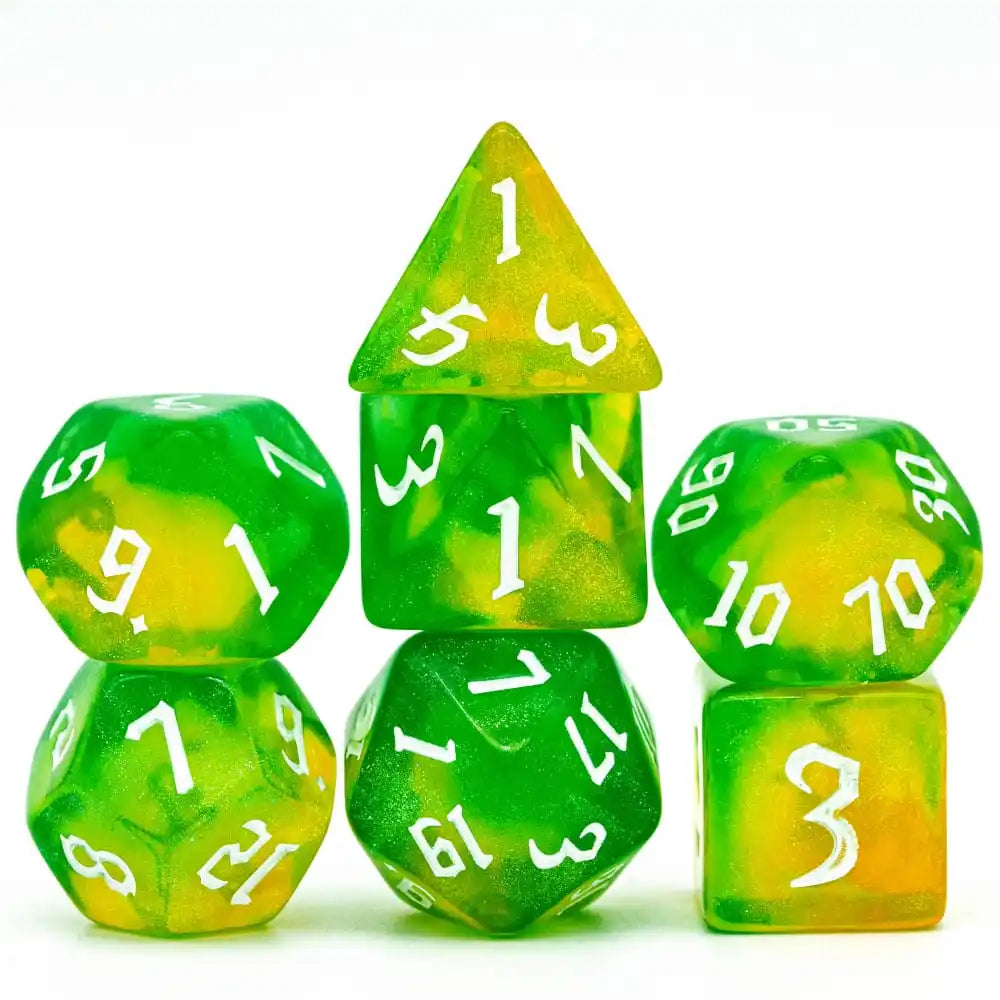 A set of seven translucent green and yellow glitter polyhedral dice, including a tetrahedron and a cube.