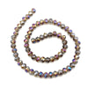 A strand of faceted crystal beads in various shades of brown and amber used for jewelry making.