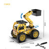 A yellow metal building block off-road vehicle or excavator engineering kit with large tires and a lifting mechanism.