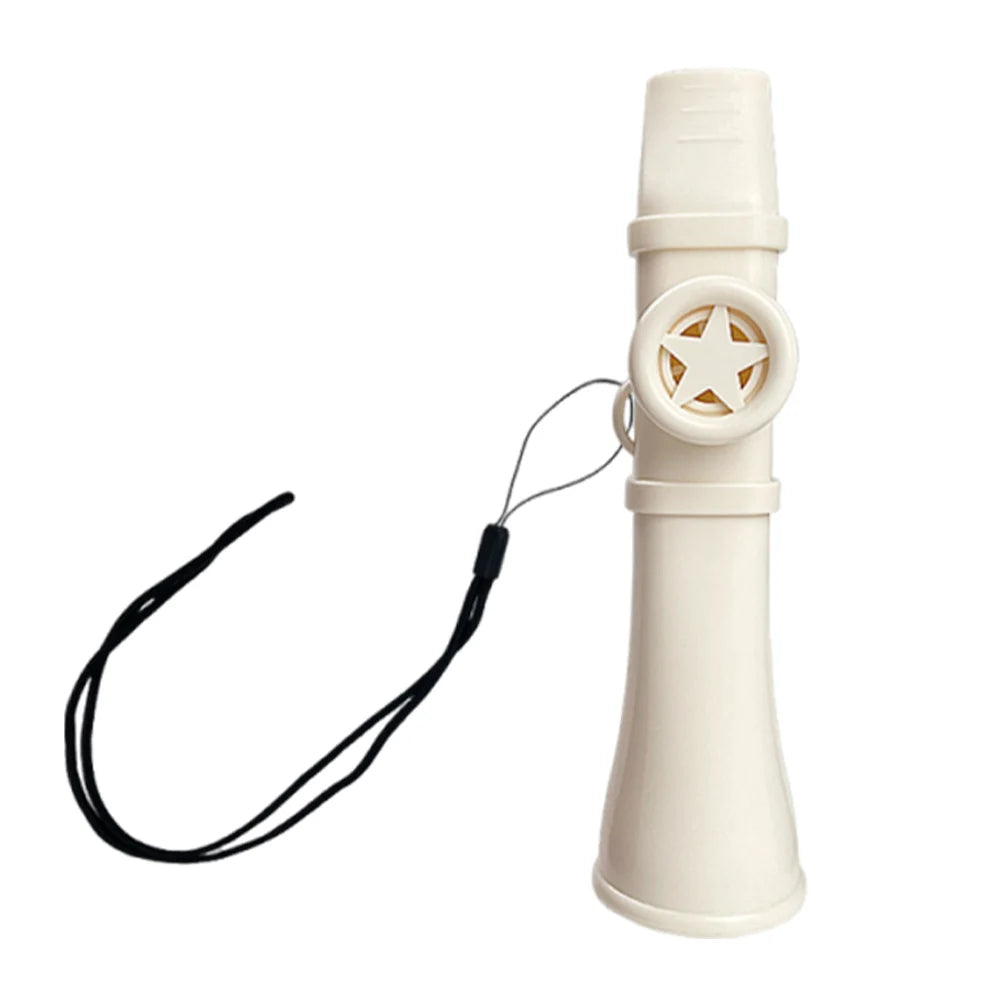 A beige portable kazoo flute with a lanyard attached, shown vertically.