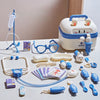 A kids doctor play set featuring a white medical kit, stethoscope, various tools, and toy patients.
