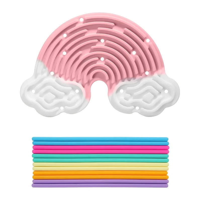 A pink and white silicone busy board with a cloud shape for sensory and fine motor development.