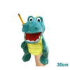 A realistic plush hand puppet of a green crocodile with yellow skin and an orange stick.