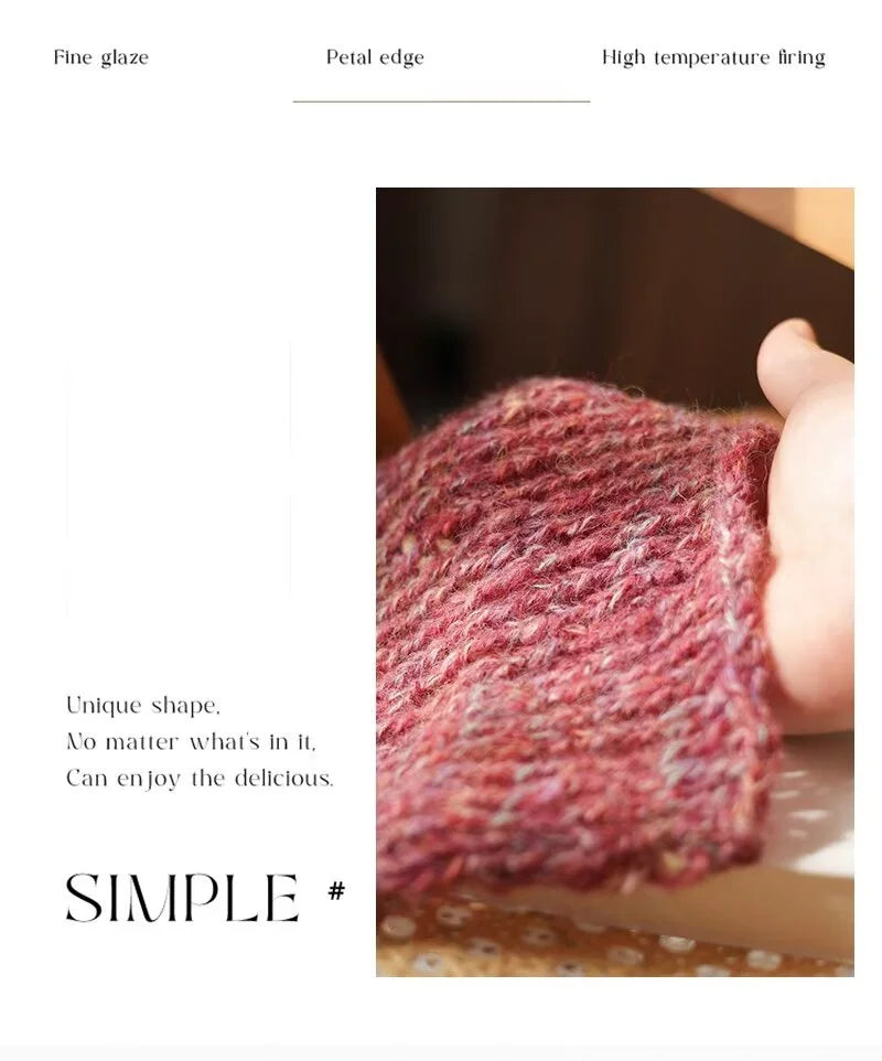 A close-up of a knitted sweater cuff in a deep pink color showing fine glaze texture and petal edge detail.
