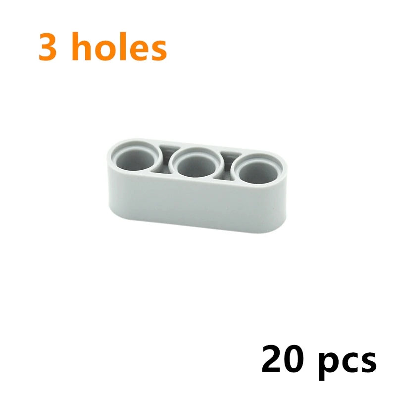 A white plastic piece with three circular holes, part of a 20-piece building block set.