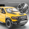 Yellow RAM TRX diecast pickup truck model with black accents and tire tread detail
