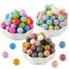 A collection of 50 assorted silicone beads in various colors and sizes displayed in white bowls.
