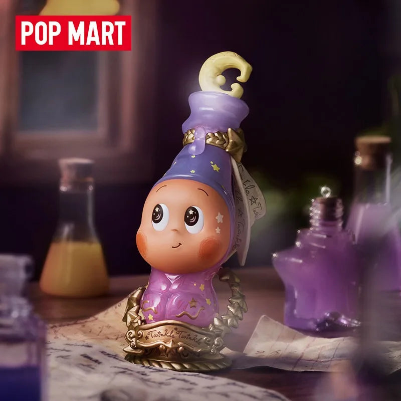 A purple collectible figure blind box with a gold crown and purple attire sits on a wooden surface.