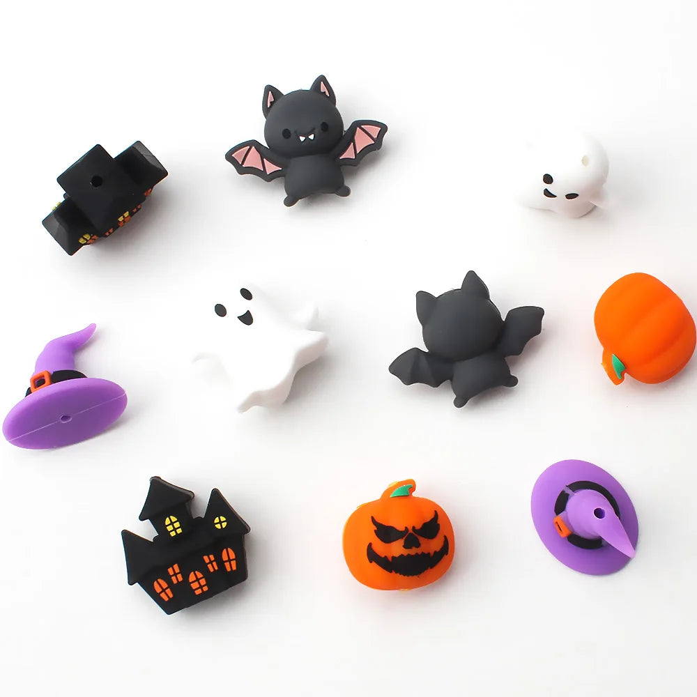 A collection of Halloween silicone beads featuring 3D bat and pumpkin shapes for jewelry making.