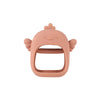 A pink silicone teether shaped like a hand for babies.