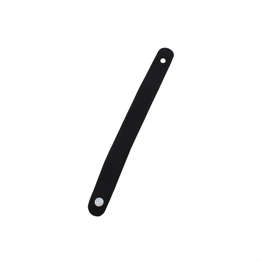 Black leather guitar strap button with a metal fastener.